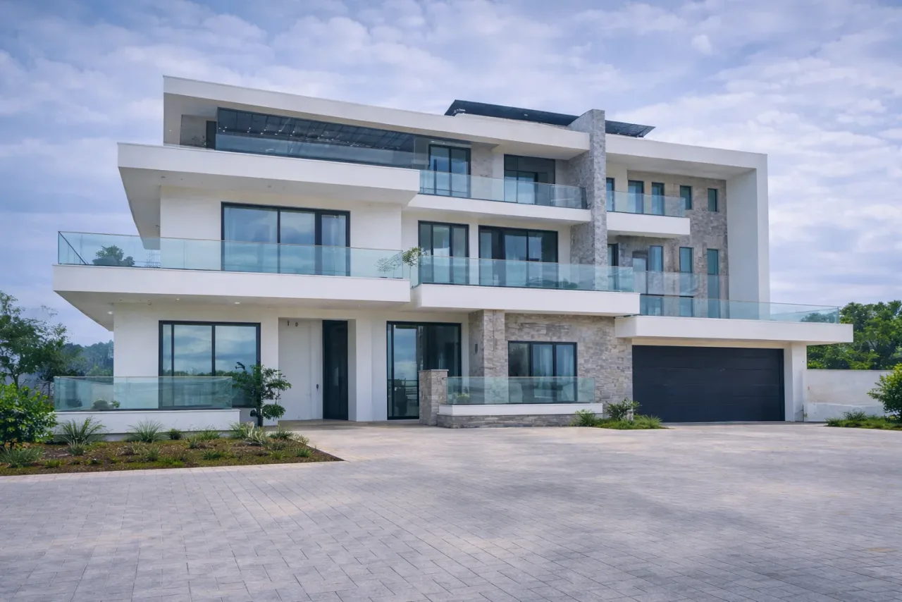 Modern home with aluminium-framed windows and glass balcony balustrades